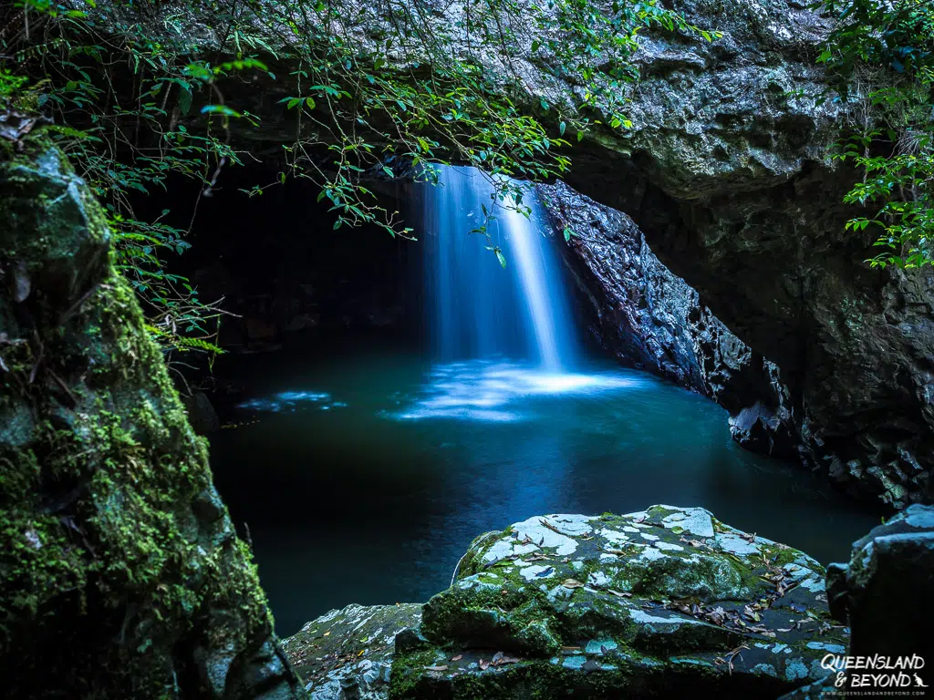 Natural Bridge waterfall dropping into the cave