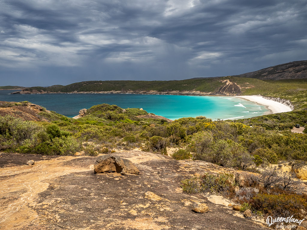 Looking down from rugged granite rocks at the brilliant turquoise water and white sand of Hellfire Bay in Cape Le Grand National Park.